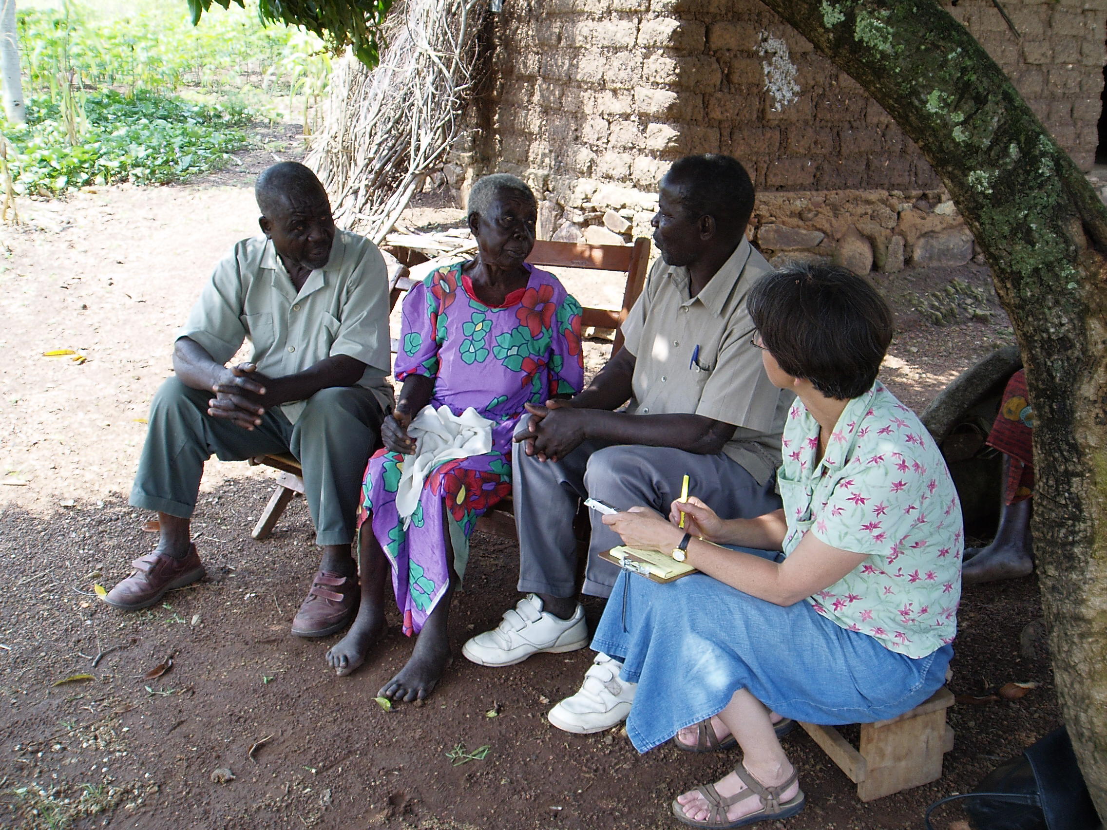 Photograph of Ariya (Juliana) Saramba, Jan Bender Shetler, Zedekia Oloo Siso, and one other at interview