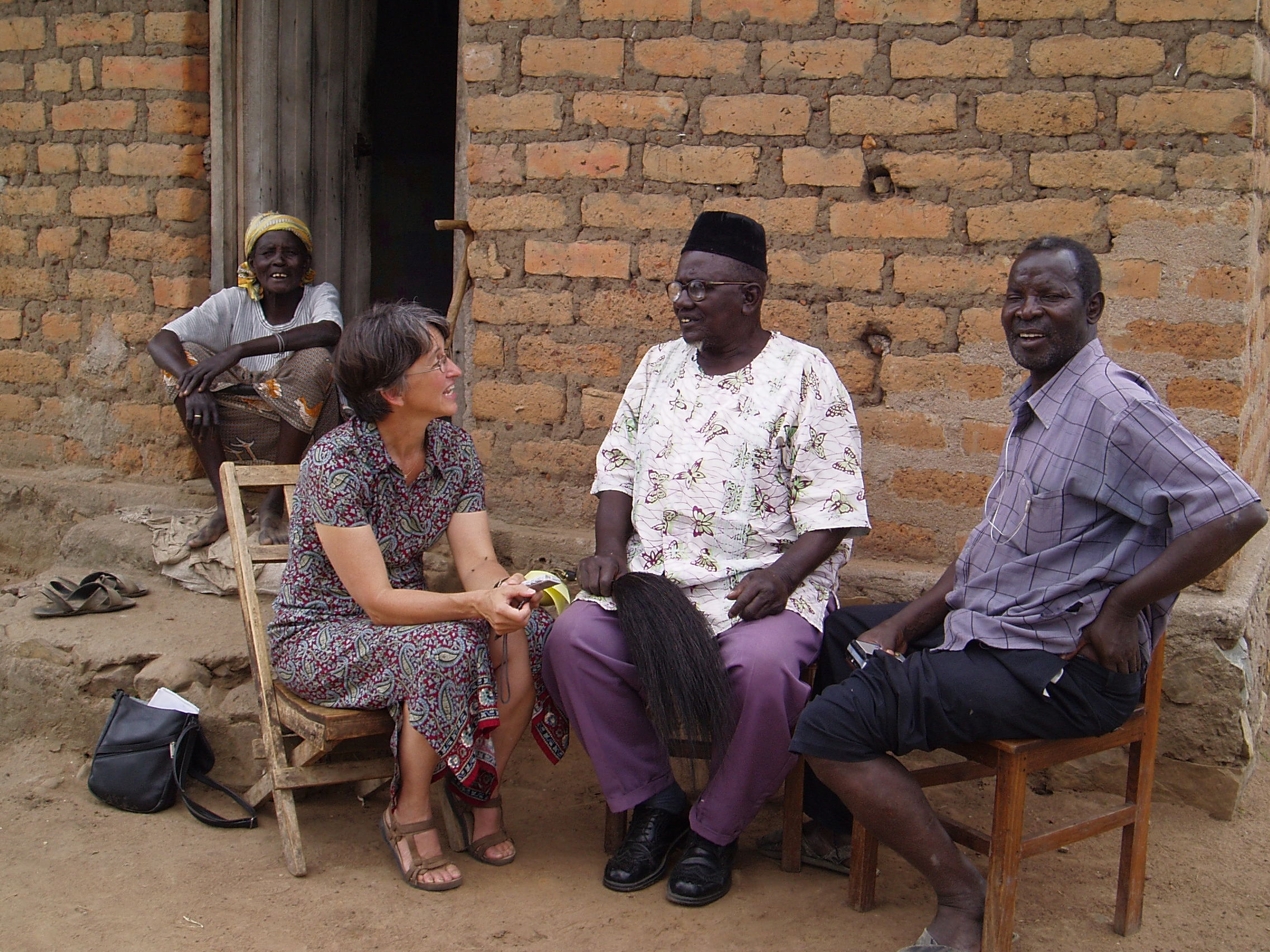 Photograph of Alexander Ogoche Ayo, Jan Bender Shetler, Zedekia Oloo Siso, and one other at interview